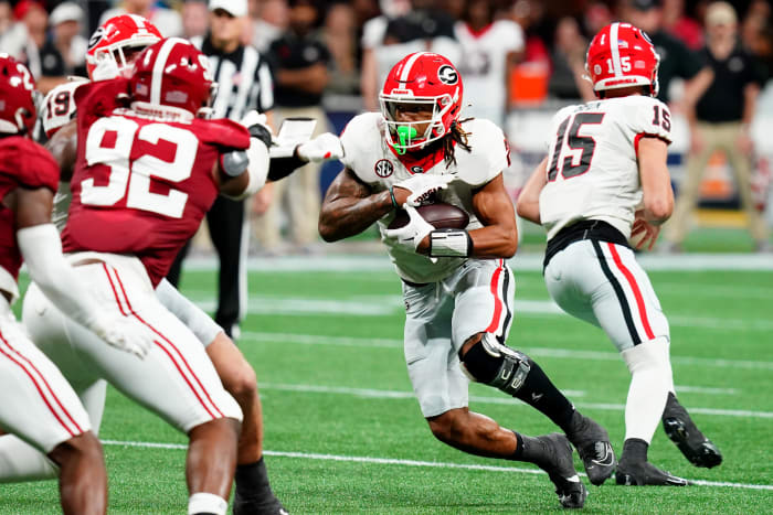 Dec 2, 2023; Atlanta, GA, USA; Georgia Bulldogs running back Kendall Milton (2) runs the ball in the second quarter against the Alabama Crimson Tide in the SEC Championship at Mercedes-Benz Stadium. Mandatory Credit: John David Mercer-USA TODAY Sports